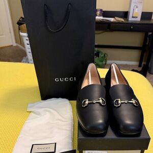 Gucci Black Leather Loafers with Gold Accents